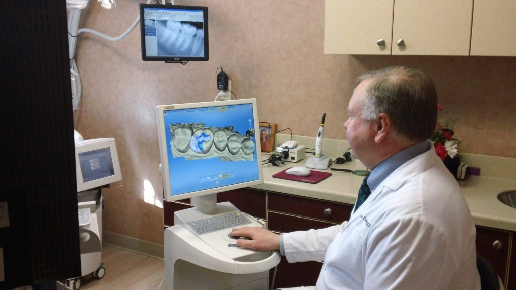 Photo of Simsbury CT dentist working with CEREC machine